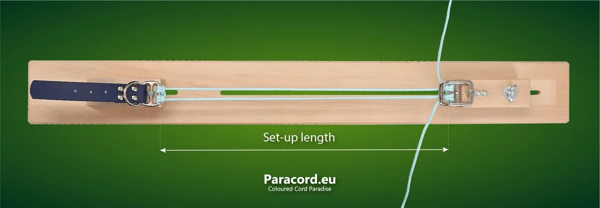 Paracord set-up on wooden jig with indication what the setup length refers to