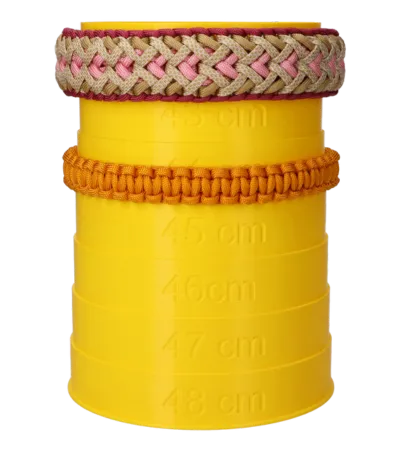 Two collars around a yellow measuring tower to measure the inner size of the collars