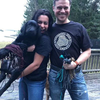 Mathias, his wife, one of their dogs, paracord and Mathias is wearing Knotgames merch